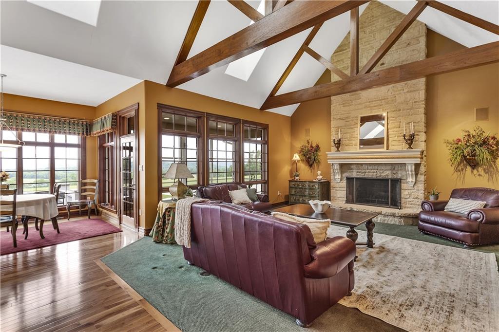 39 Caven Road Ligonier, PA 15658 - Photo 10 of 33 The Family Room with vaulted ceilings and beams features a gas-start, wood-burning fireplace.