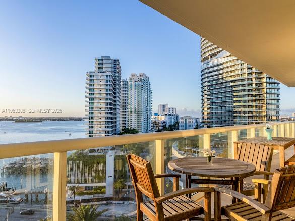 450 Alton Road, Unit 1202 Miami Beach, FL 33139 - Photo 12 of 68 a view of swimming pool with outdoor seating and city view