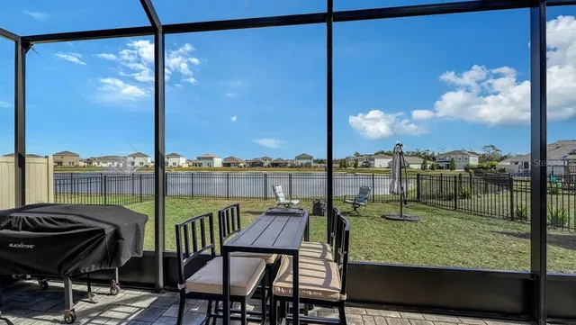 a view of a balcony with chair and table
