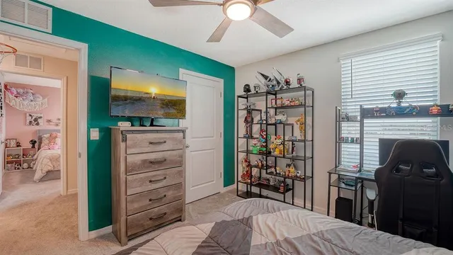 a bedroom with a bed and furniture