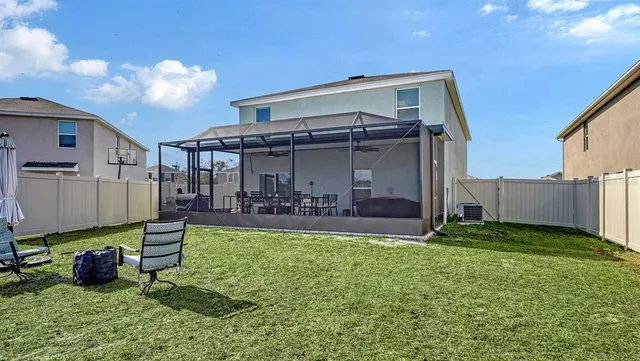 a view of a chair and table in backyard