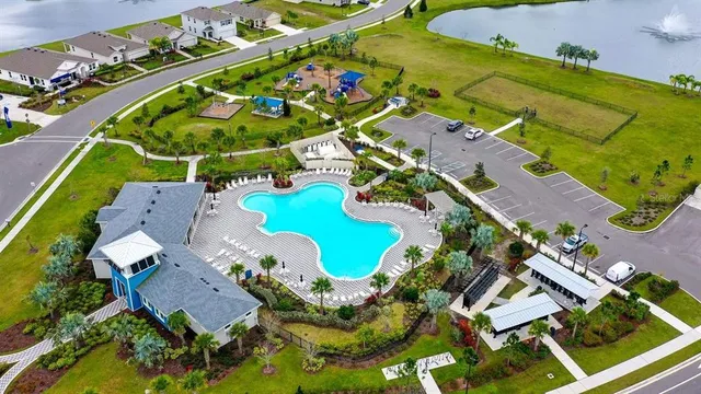 an aerial view of a house with a swimming pool