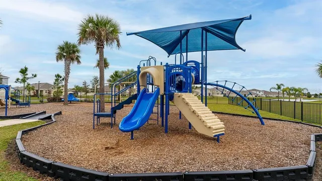 a view of a park with a slide