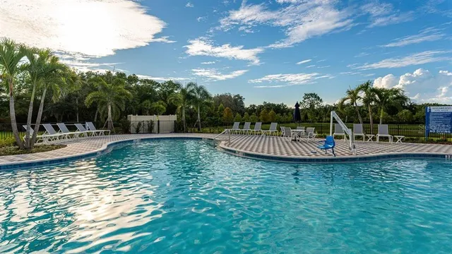 a view of a swimming pool with a patio