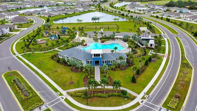 a view of a swimming pool with a patio