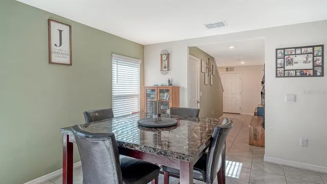 a dining room with table and chair