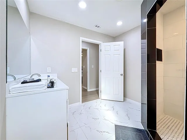 a bedroom with a bed and a table