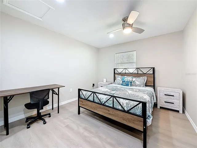 a bathroom with a toilet a sink a mirror and a shower