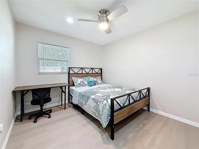 a view of a house with swimming pool and sitting area