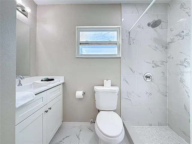 a balcony view with a dining table and chairs with wooden floor