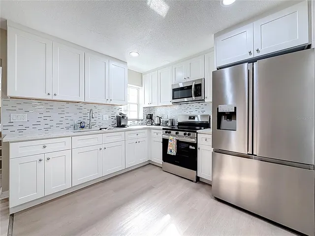 a view of livingroom with a flat screen tv and a fireplace