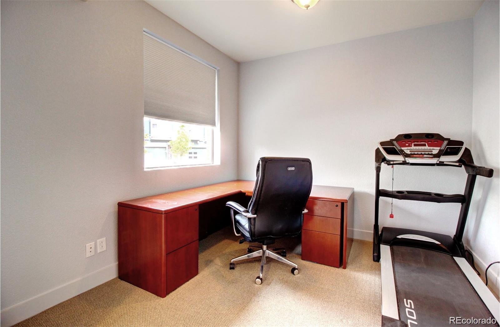 2360 South Wheeling Circle Aurora, CO 80014 - Photo 11 of 26 a view of a workspace with furniture and a window