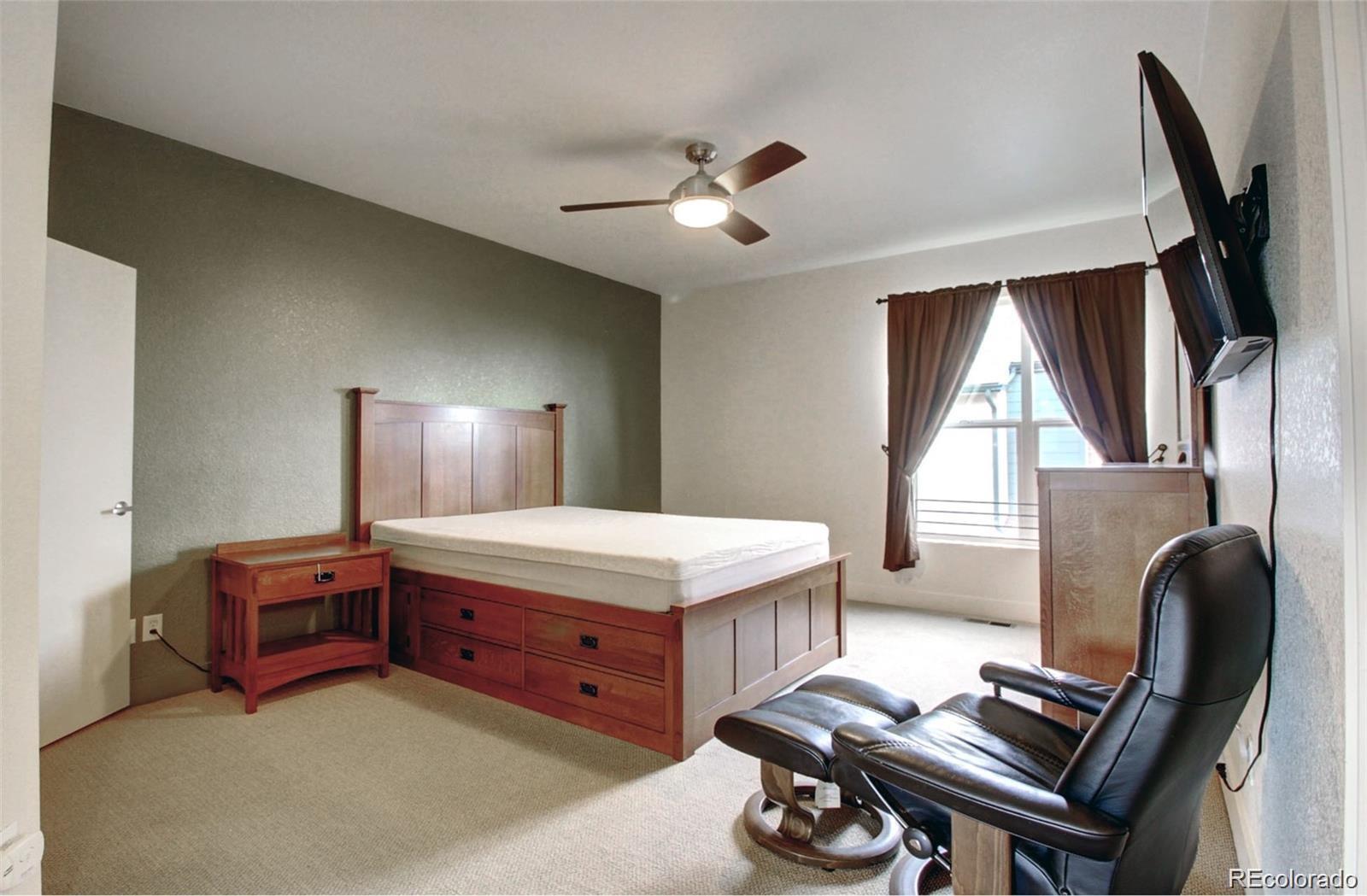 2360 South Wheeling Circle Aurora, CO 80014 - Photo 18 of 26 a bed room with a bed and a window