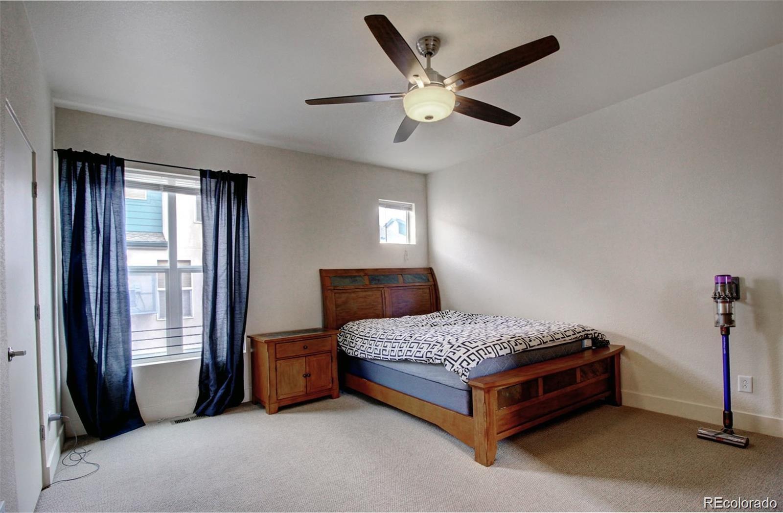 2360 South Wheeling Circle Aurora, CO 80014 - Photo 24 of 26 a bedroom with a bed and a window
