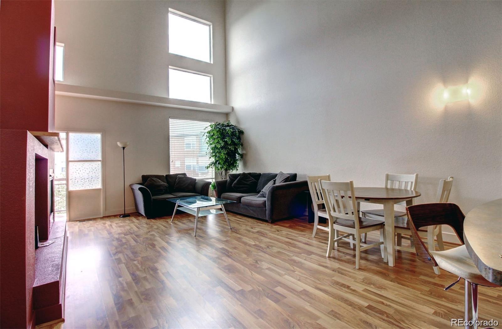 2360 South Wheeling Circle Aurora, CO 80014 - Photo 8 of 26 a living room with furniture and a window