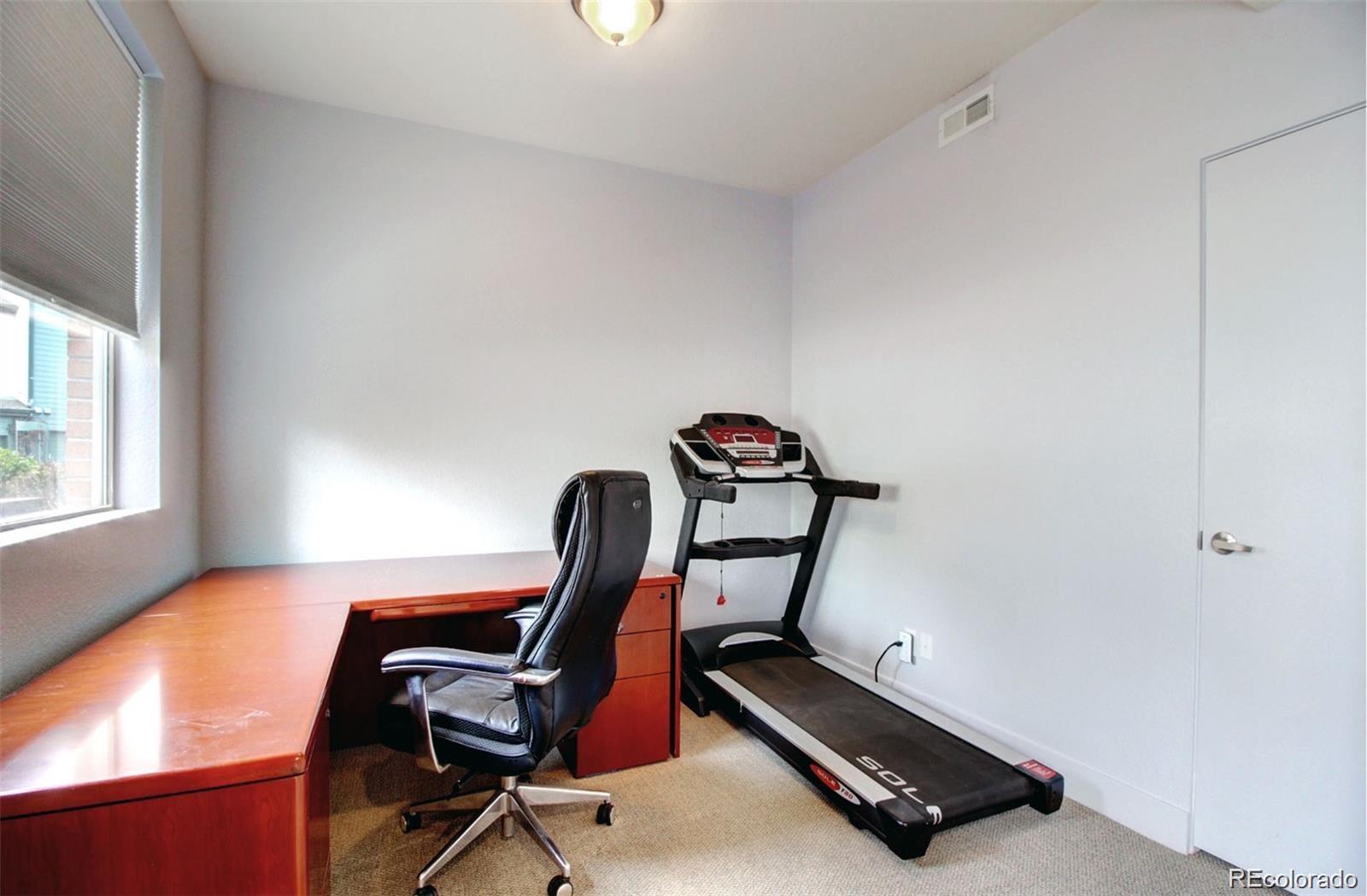 2360 South Wheeling Circle Aurora, CO 80014 - Photo 10 of 26 a view of a room with gym equipment