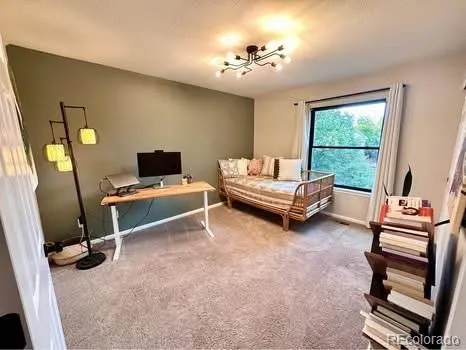 a bedroom with furniture and a window