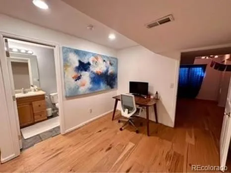 a living room with furniture a ceiling fan and a window