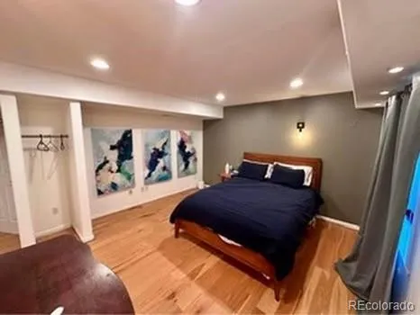a bathroom with a granite countertop toilet and a mirror