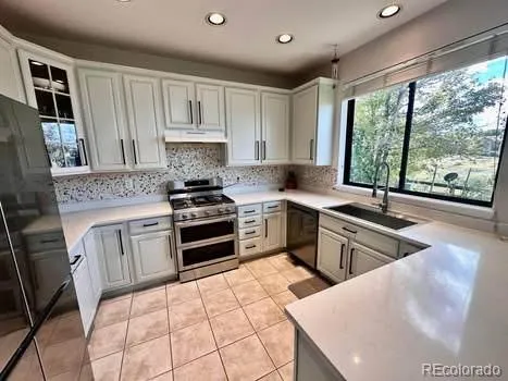a spacious bathroom with a sink mirror and shower