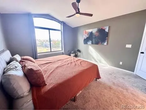 a bedroom with furniture and a window