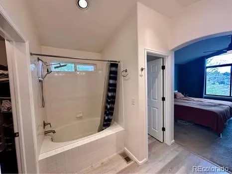 a bathroom with a double vanity sink toilet and shower