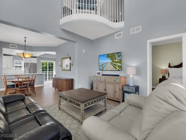 a living room with furniture and fireplace