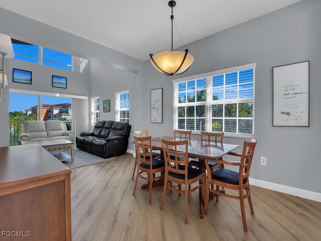 4500 Botanical Pl Circle, Unit 4 Naples, FL 34112 - Photo 11 of 43 a view of a dining room with furniture window and wooden floor