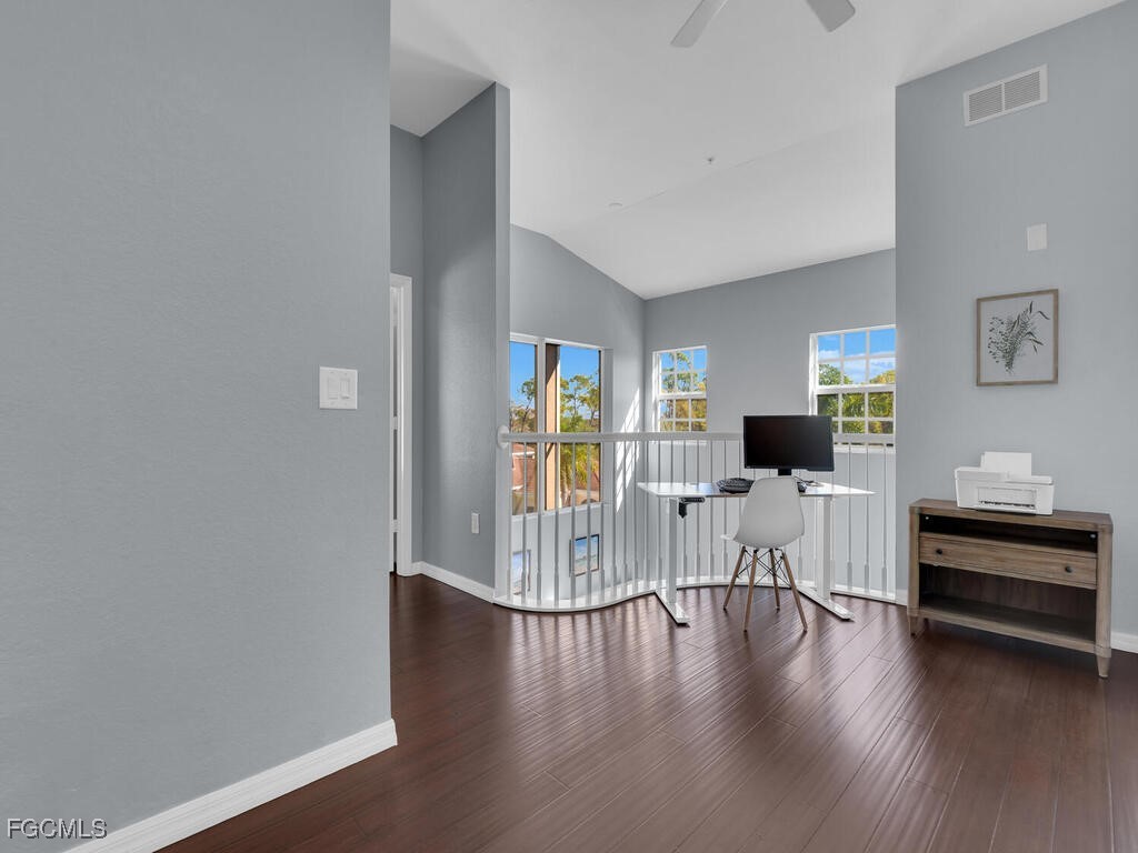 4500 Botanical Pl Circle, Unit 4 Naples, FL 34112 - Photo 20 of 43 a living room with furniture and a wooden floor