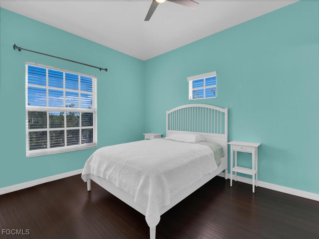 4500 Botanical Pl Circle, Unit 4 Naples, FL 34112 - Photo 23 of 43 a bedroom with a bed and window