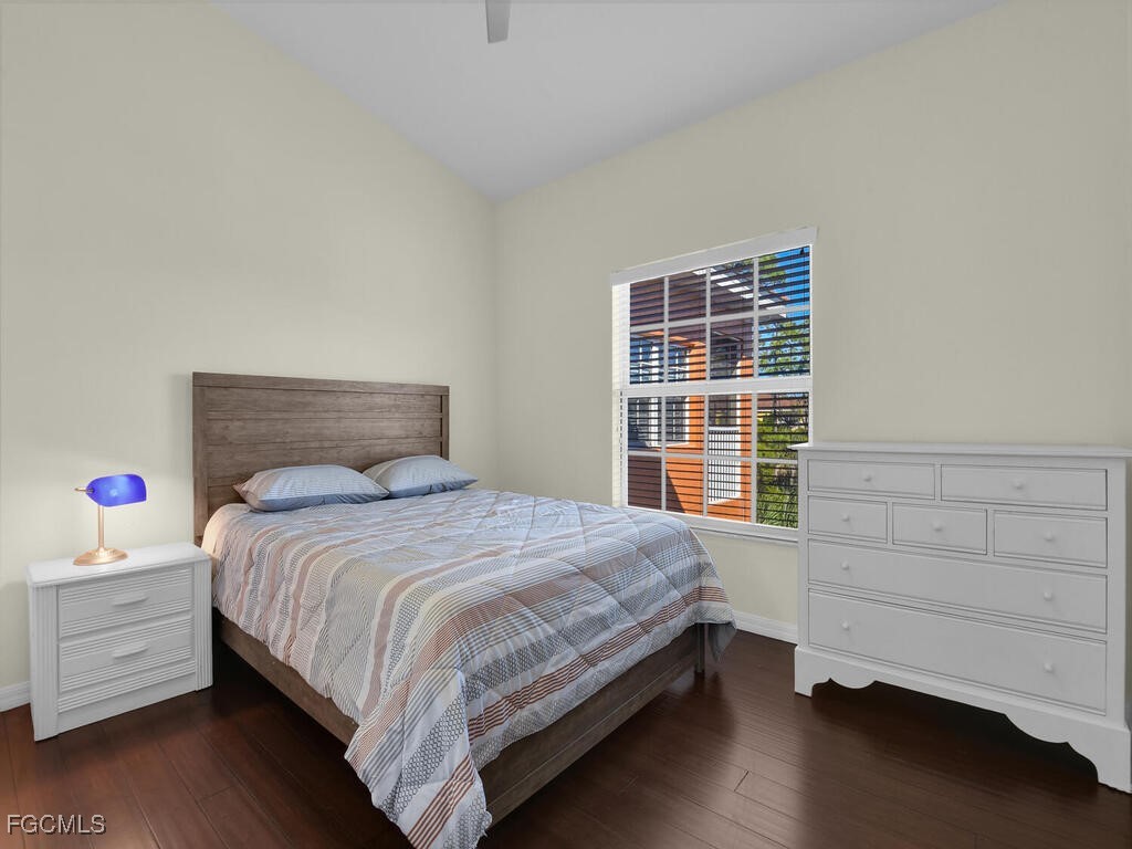 4500 Botanical Pl Circle, Unit 4 Naples, FL 34112 - Photo 26 of 43 a bedroom with a bed and a window