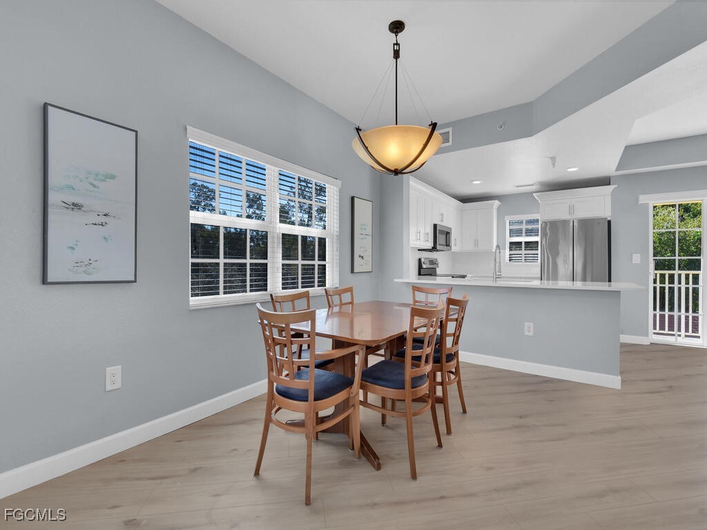 4500 Botanical Pl Circle, Unit 307 Naples, FL 34112 - Photo 3 of 43 a view of a dining room and livingroom