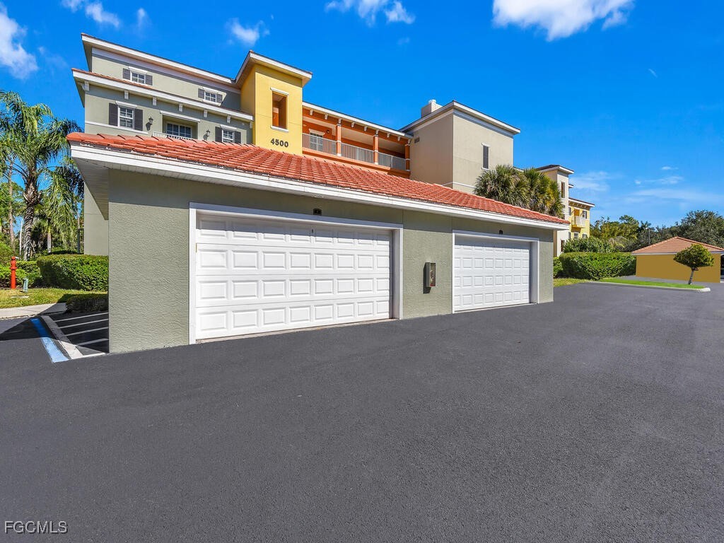 4500 Botanical Pl Circle, Unit 4 Naples, FL 34112 - Photo 31 of 43 a view of a building with a road