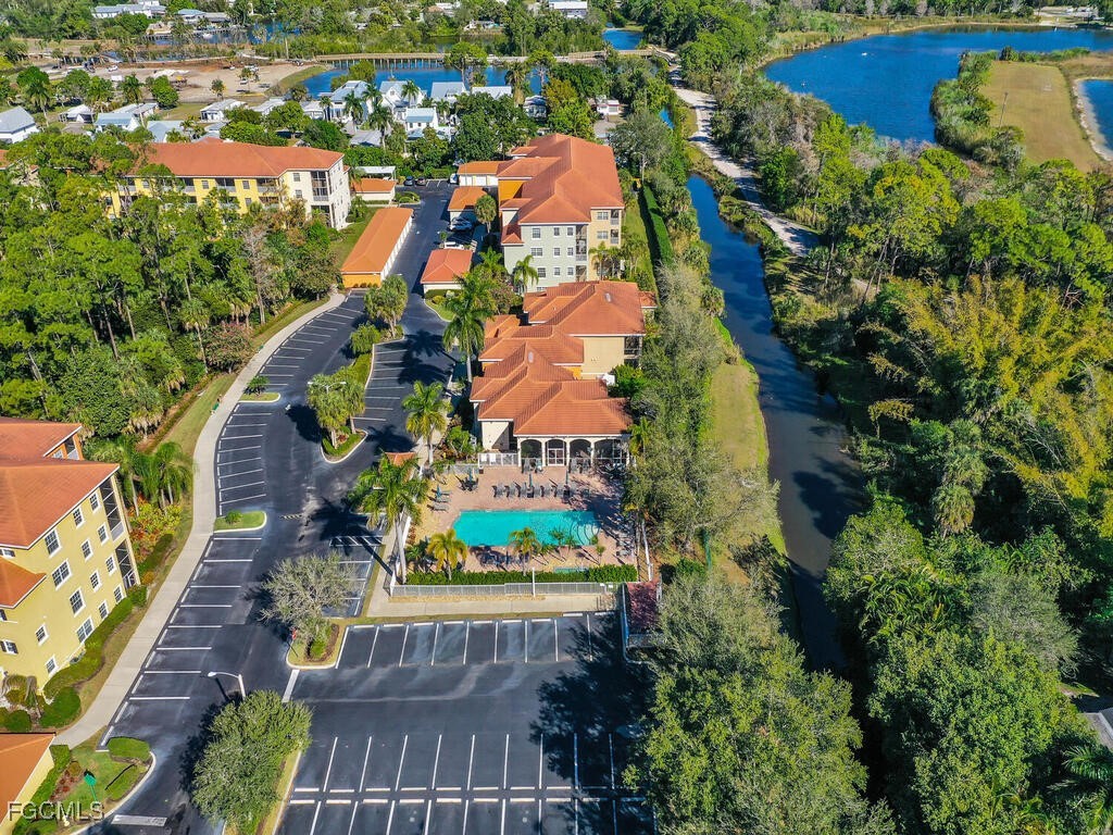 4500 Botanical Pl Circle, Unit 4 Naples, FL 34112 - Photo 32 of 43 an aerial view of houses with yard