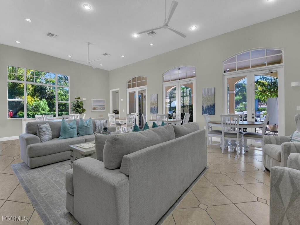 4500 Botanical Pl Circle, Unit 4 Naples, FL 34112 - Photo 39 of 43 a living room with furniture and a large window