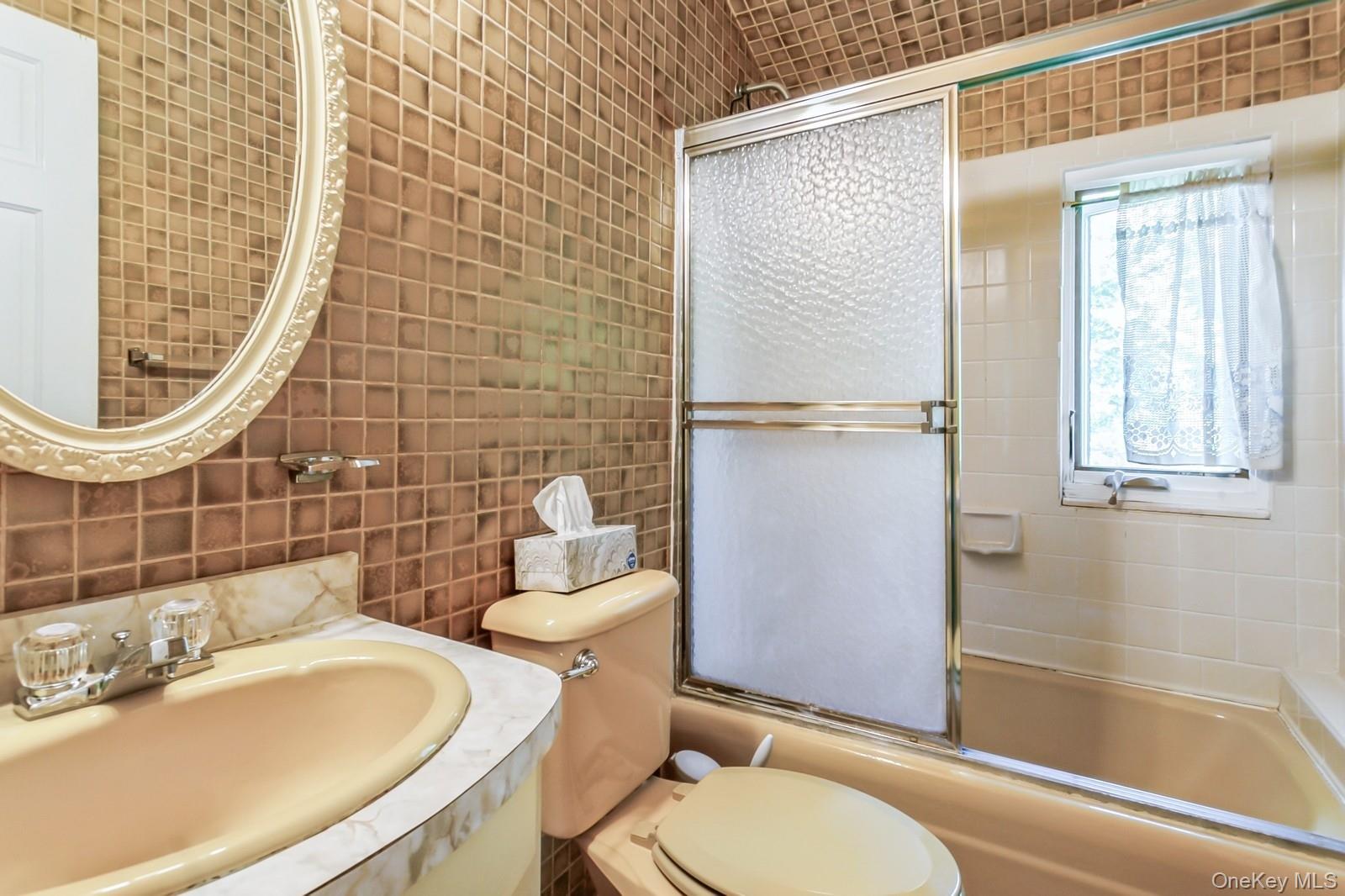 444 Milton Road Rye, NY 10580 - Photo 11 of 23 a bathroom with a sink a toilet and shower