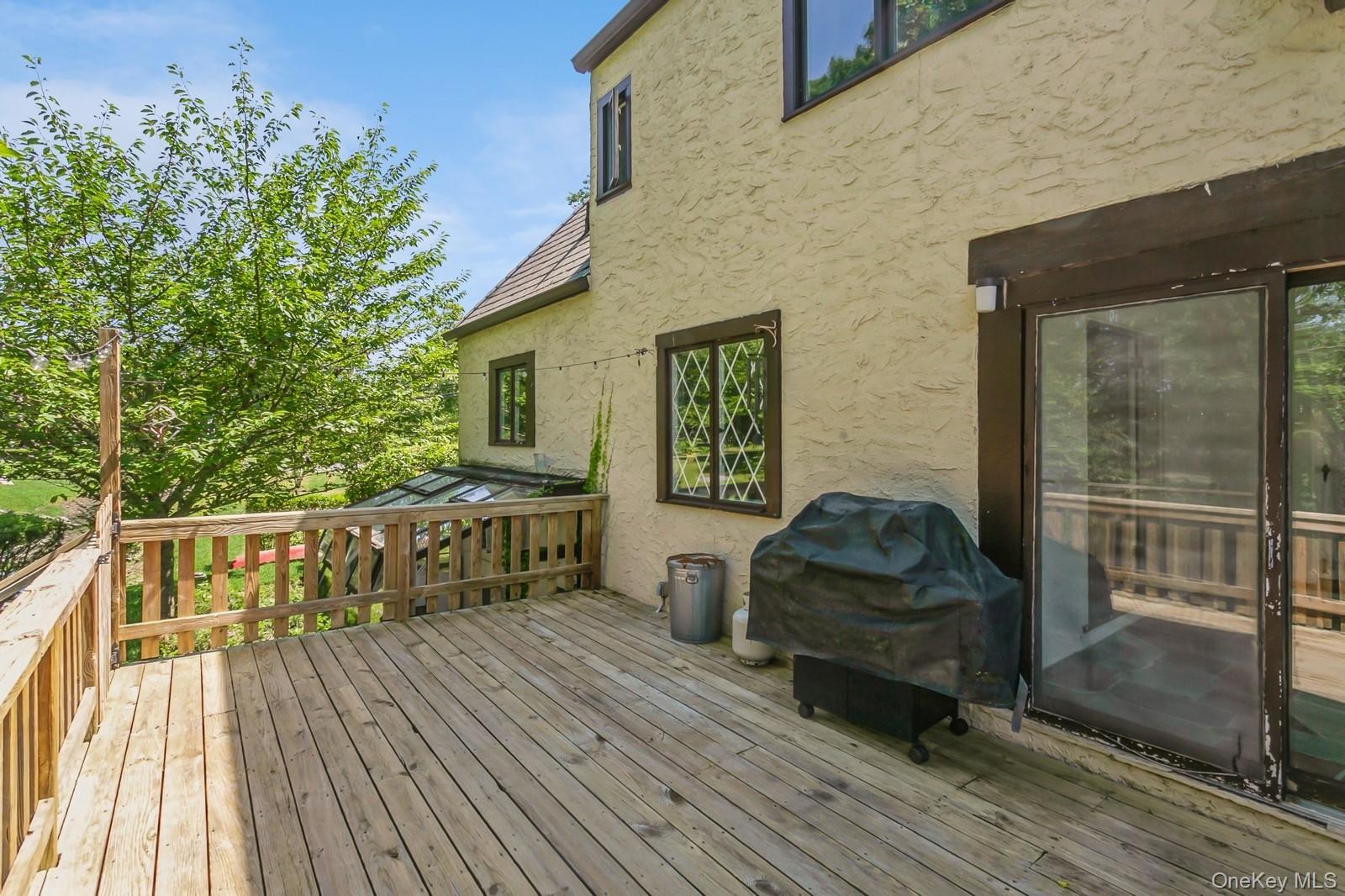 444 Milton Road Rye, NY 10580 - Photo 15 of 23 a balcony with furniture and wooden floor