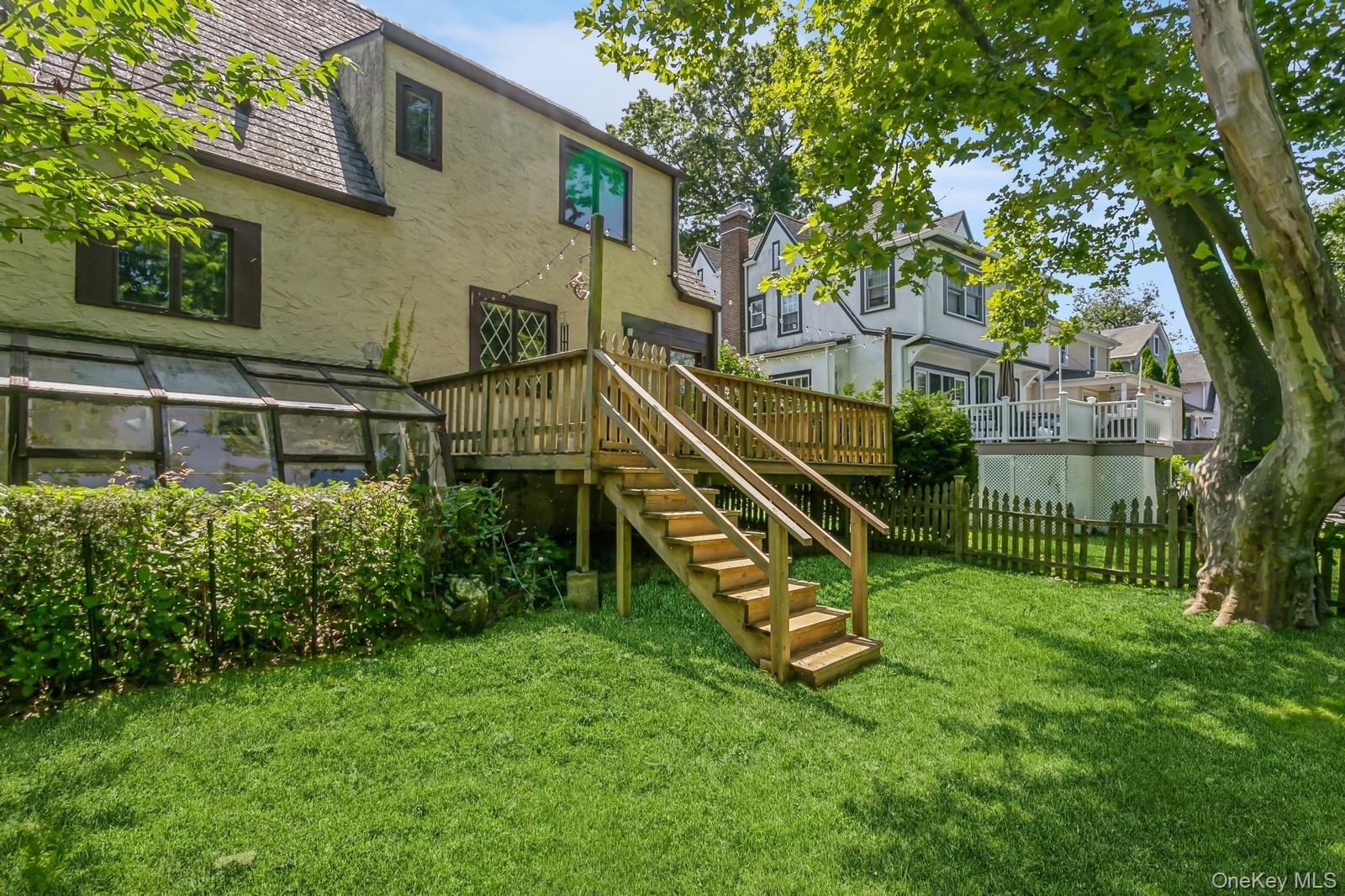 444 Milton Road Rye, NY 10580 - Photo 20 of 23 front view of a house with a yard