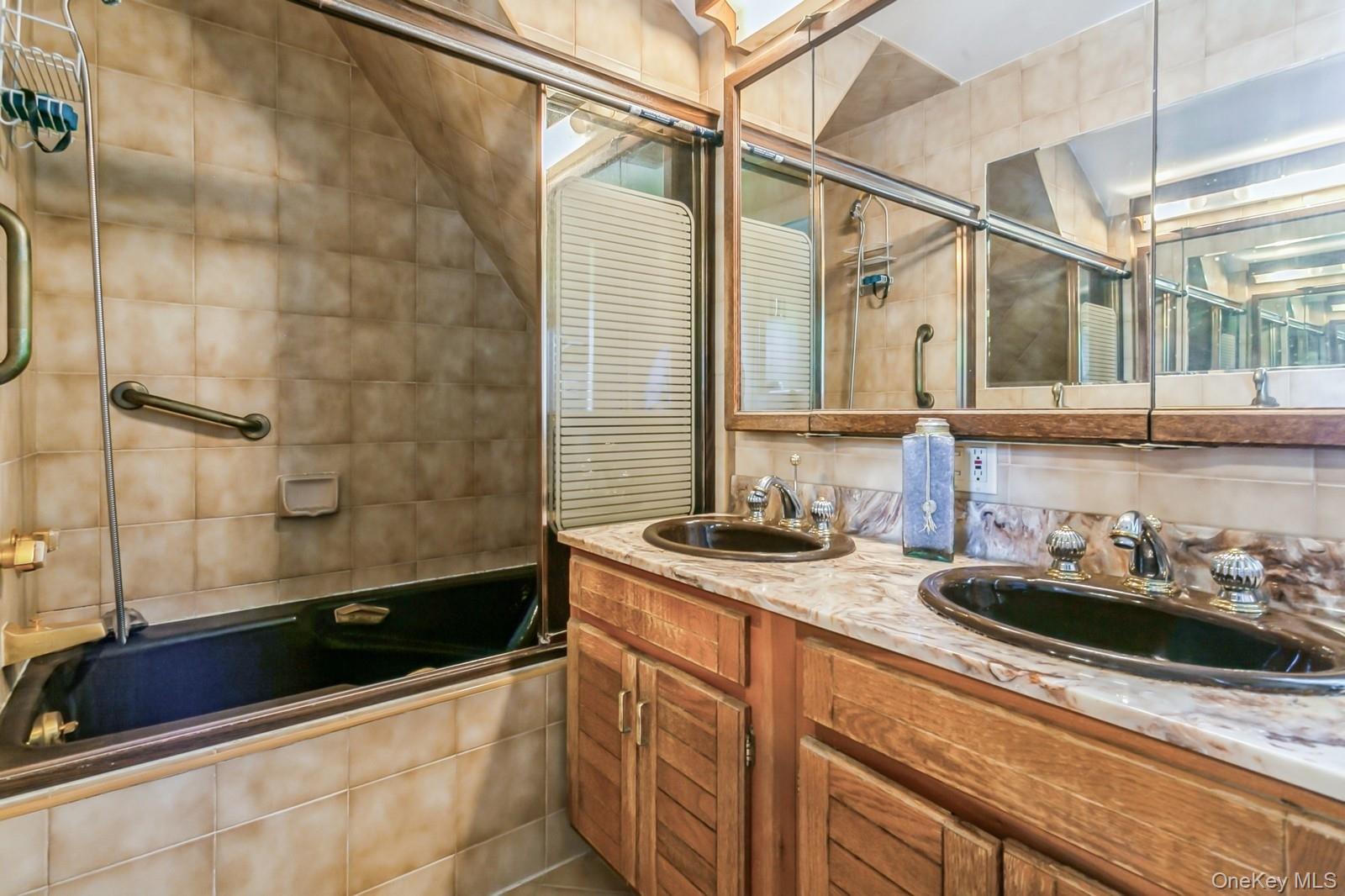 444 Milton Road Rye, NY 10580 - Photo 8 of 23 a bathroom with a sink and a bathtub