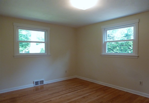 60 Jeanne Marie Street Springfield, MA 01129 - Photo 11 of 20 an empty room with wooden floor and windows