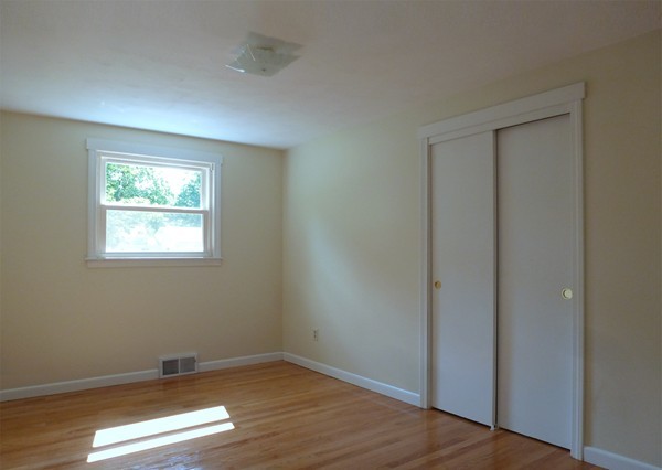 60 Jeanne Marie Street Springfield, MA 01129 - Photo 13 of 20 an empty room with wooden floor and windows