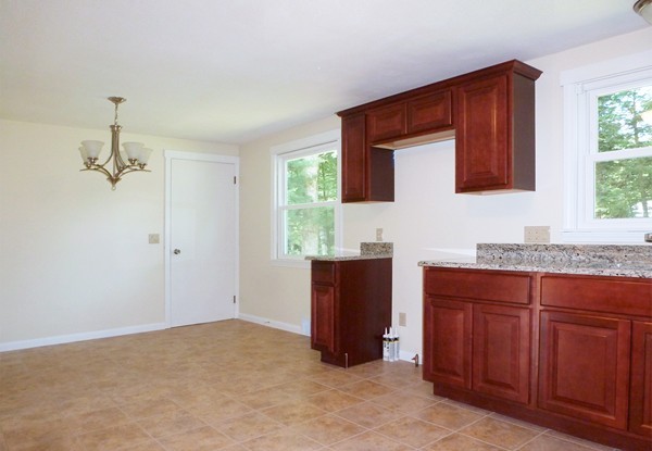 60 Jeanne Marie Street Springfield, MA 01129 - Photo 2 of 20 a bathroom with a granite countertop sink and a mirror