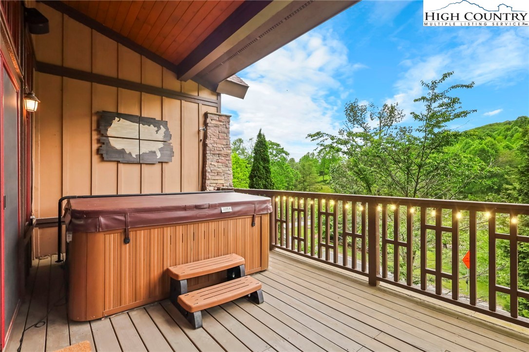 138 South Camp Road, Unit 103 Boone, NC 28607 - Photo 26 of 50 a view of a balcony with furniture and wooden floor