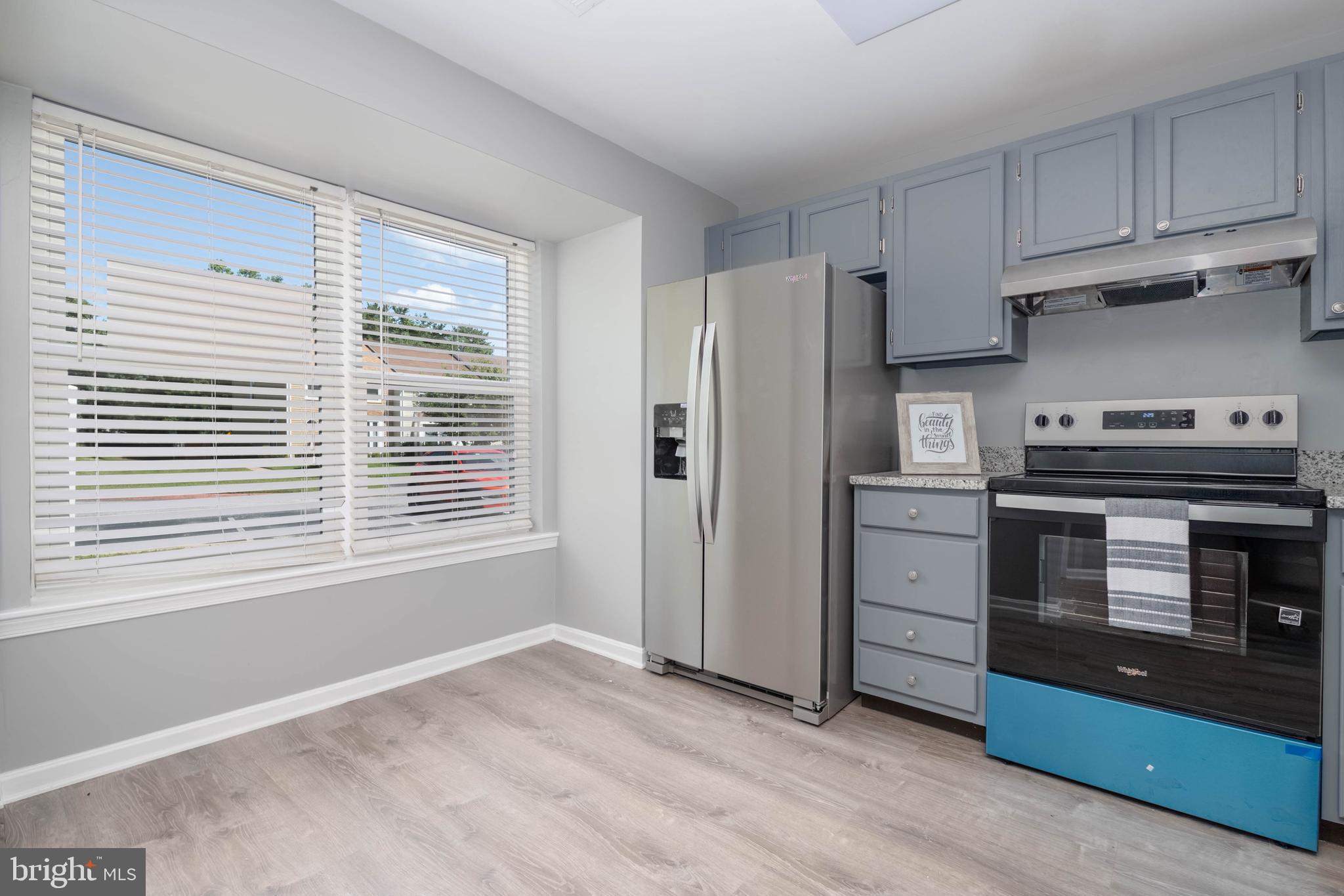 1258 Independence Square Belcamp, MD 21017 - Photo 7 of 31 a kitchen with stainless steel appliances a stove a sink and a refrigerator