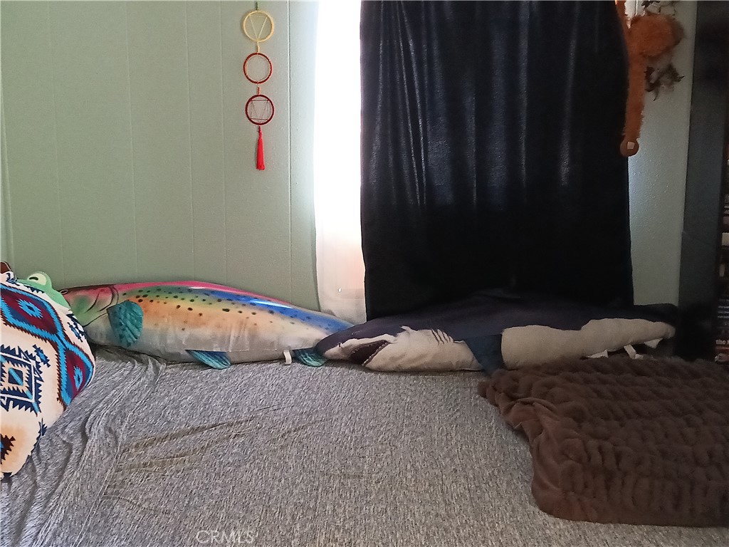 2100 Soapmine Road, Unit 44 Barstow, CA 92311 - Photo 17 of 17 a bedroom with bed and a window