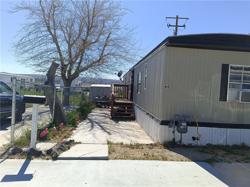 2100 Soapmine Road, Unit 44 Barstow, CA 92311 - Photo 3 of 17 a view of a house with backyard and sitting area