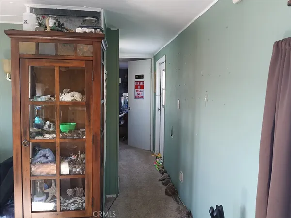 a view of a hallway with dining room