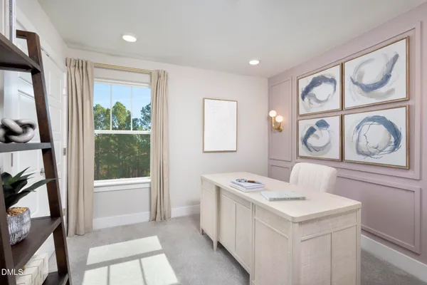 a view of entryway with workspace and window