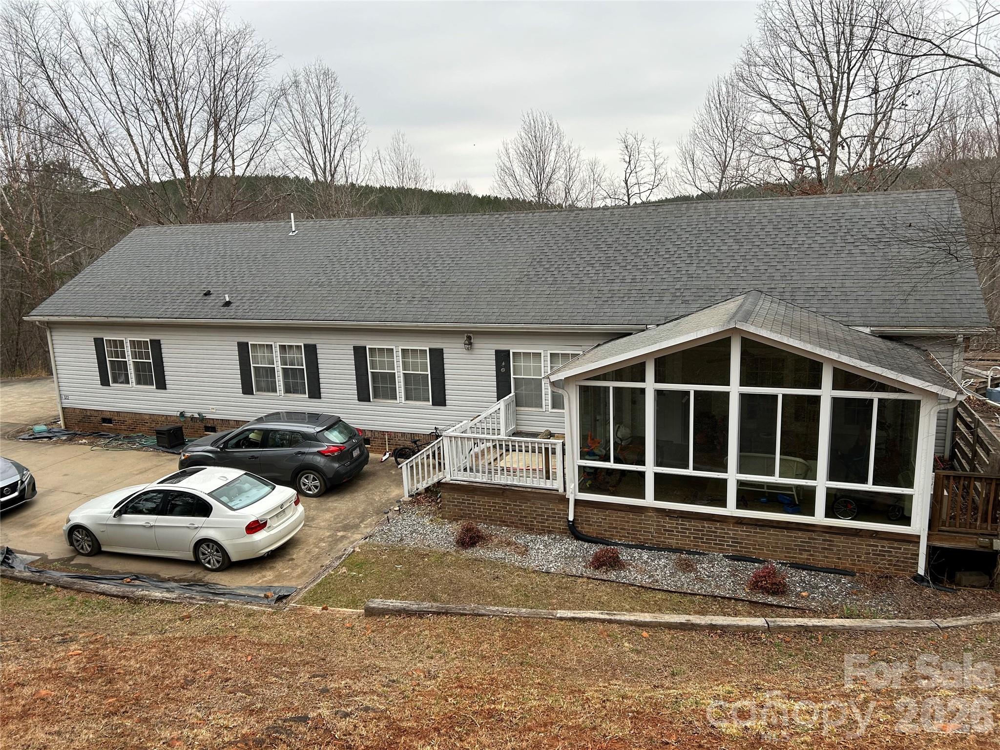 322 Balmy Lane Rutherfordton, NC 28139 - Photo 1 of 34 a front view of a house with a yard and parking space