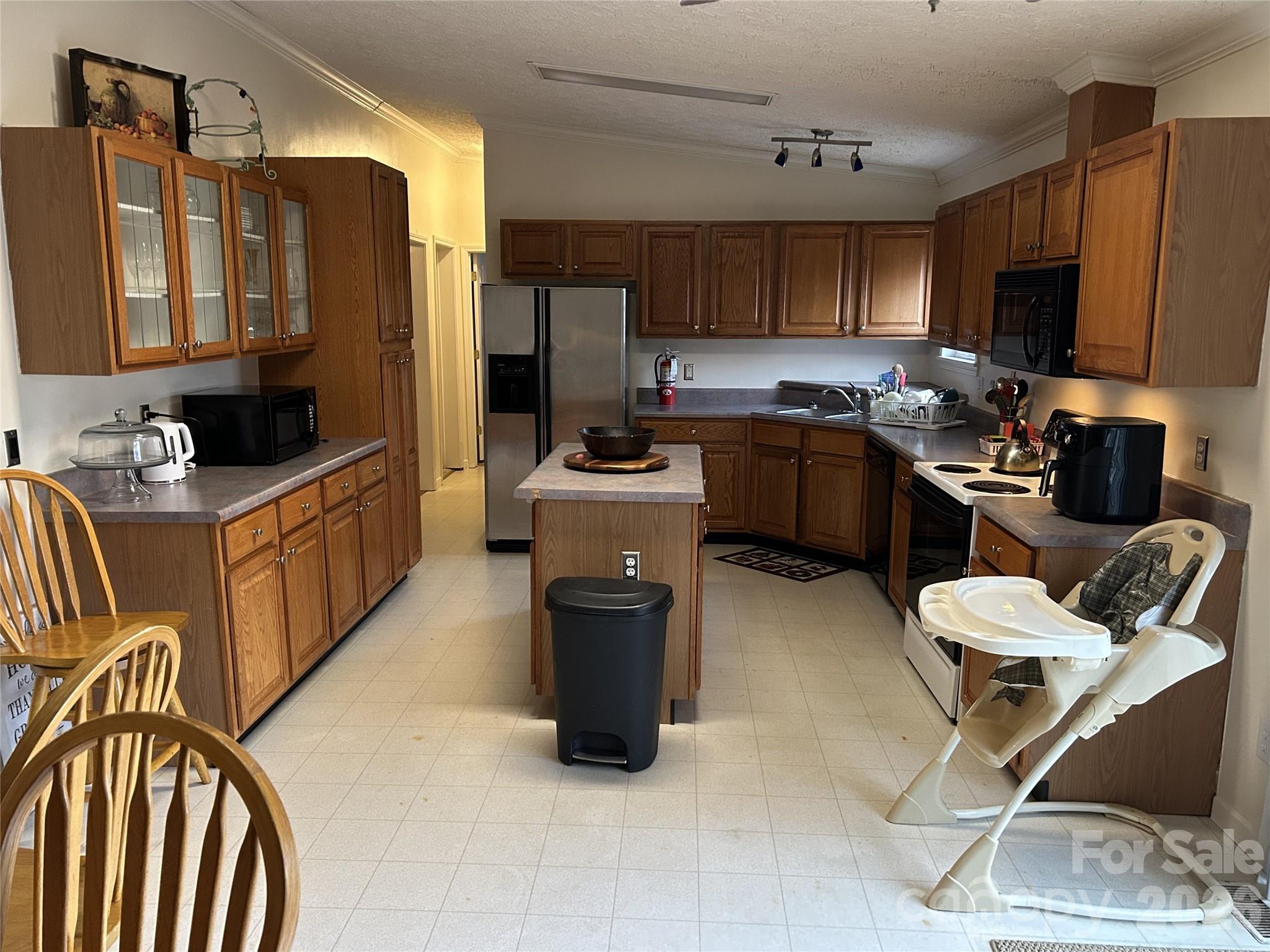 322 Balmy Lane Rutherfordton, NC 28139 - Photo 14 of 34 a kitchen with a refrigerator stove top oven and sink